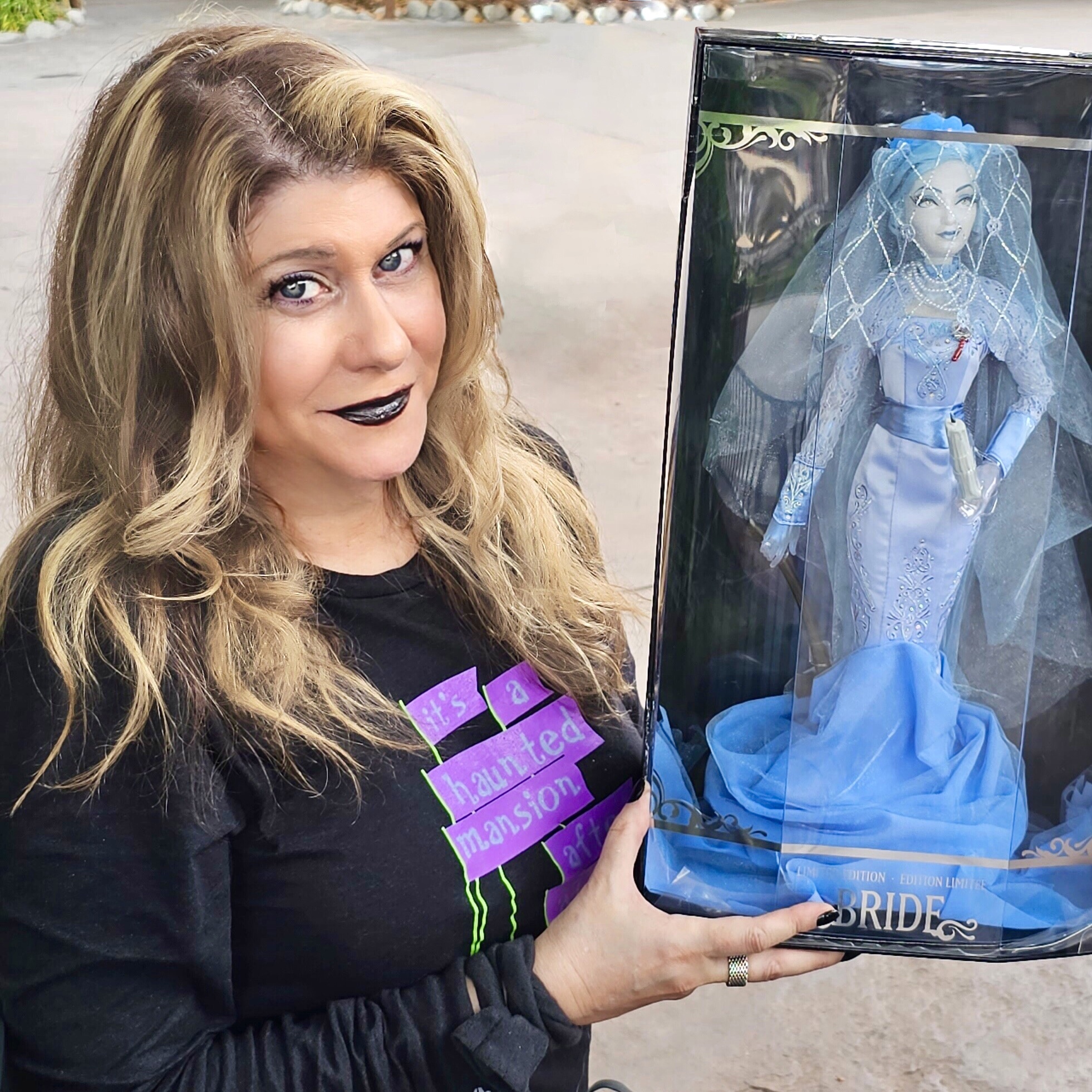 Kat Cressida The Haunted Mansion Bride herself poses With Constance Hatchaway doll at Disneyland